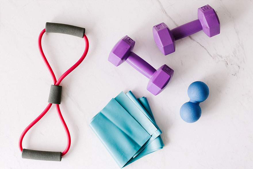 Set of fitness equipment placed on marble